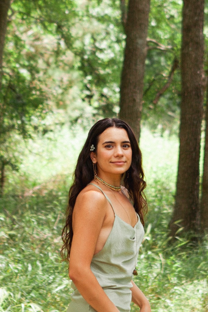 Kat Huizar — ceremonialist and guide, outdoors among trees