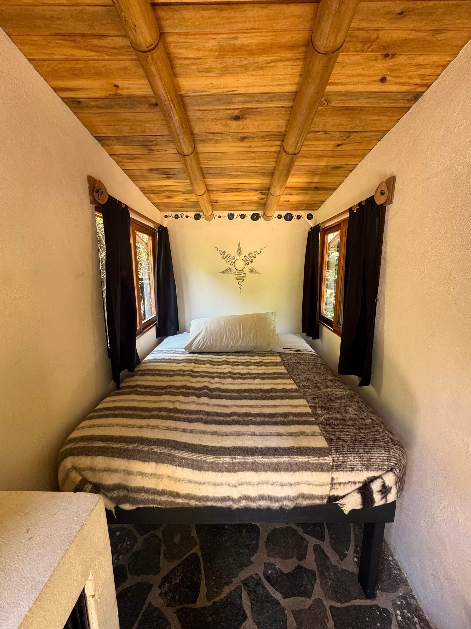 Wooden double bed cabin 2 — exterior view, lush garden